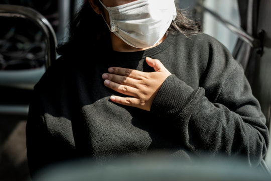 Sick Woman In A Mask Having A Difficulty Breathing During Coronavirus Pandemic