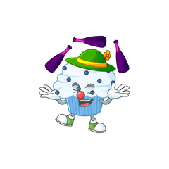 mascot cartoon style of vanilla blue cupcake playing Juggling on stage