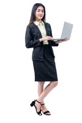Asian businesswoman standing while using laptop