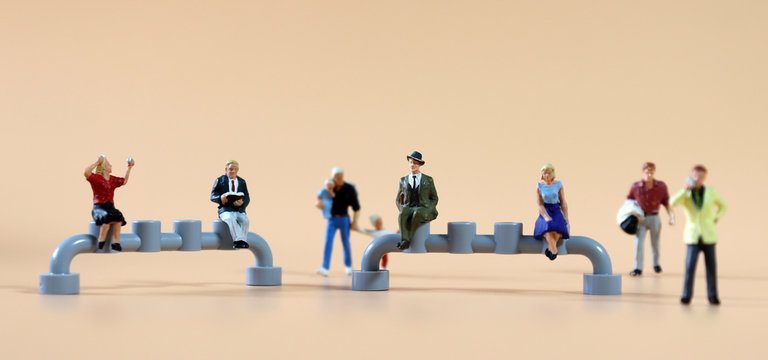 The concept of social distancing. Various miniature people.
- Powered by Adobe
