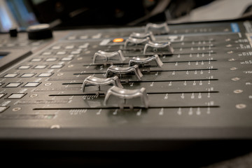 Close-up of sound mixer in recording studio