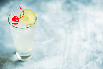 Rum collins cocktail (variation of traditional Tom collins). Selective focus. Shallow depth of field.