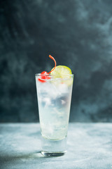 Rum collins cocktail (variation of traditional Tom collins). Selective focus. Shallow depth of field.