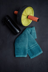Home fitness yoga mat and abdominal wheel. Yoga mats and abdominal wheels in the gym.