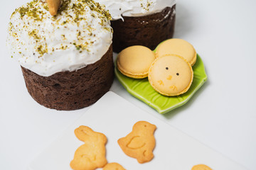Easter treats on the table, cakes with meringue, macaroons and cookies are beautiful and delicious