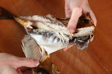 Removing skin and bones from smoked mackerel