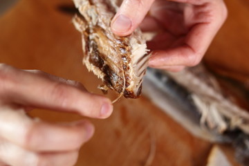 Removing skin and bones from smoked mackerel