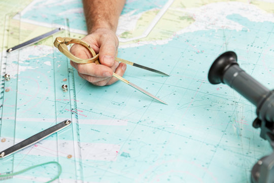 Measuring distance on a sea chart tool. Close-up. Navigation in the maritime industry and yachting.
