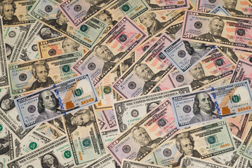 Background from American dollar bills of various denominations and years of issue