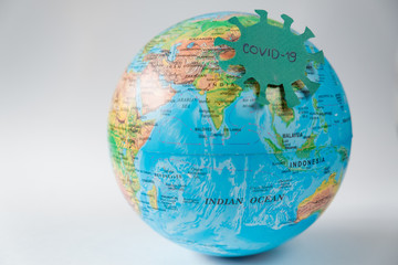  Pandemic Covid-19. Globe with the coronavarus virus on a white background. The concept of a global epidemic.