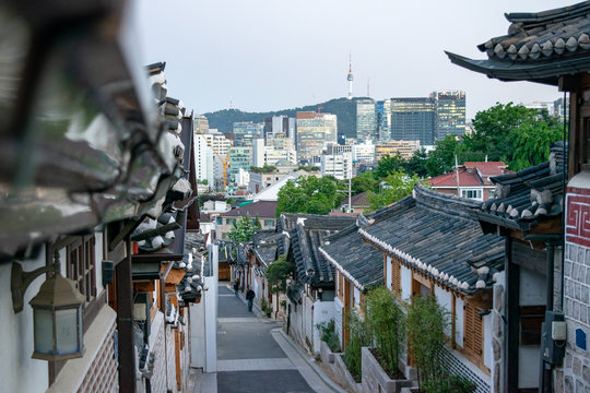 Traditional Bukchon Hanok Village and Skyline of Seoul in Distance - Seoul, South Korea