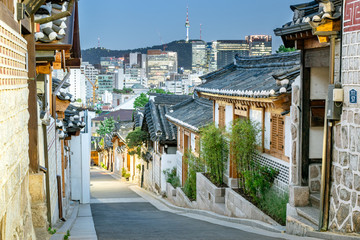 Traditional Bukchon Hanok Village and Skyline of Seoul in Distance at Dusk - Seoul, South Korea