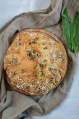 freshly baked home made no knead bread with wild garlic
