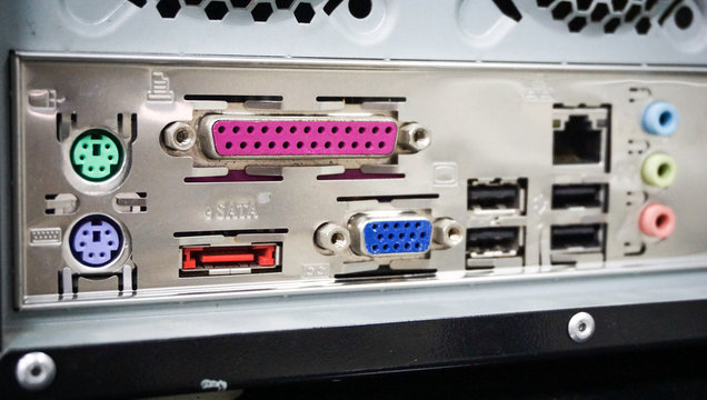 close up view of back PC computer connection panel detailed with many ports type and others sockets.