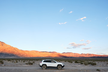 jeep cherokee trailhawk driving on 4x4 off road trail in the desert © Samuel