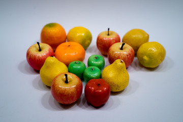 toy fruits on light blue background