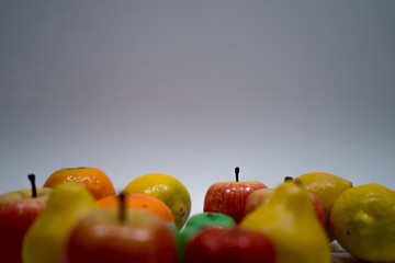 toy fruits on light blue background