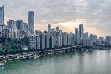 Sunset over Jialing river with dense residence buiding in Chongqing, China