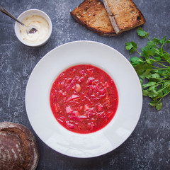 Borsch in a white plate, Menu, Russian cuisine recipe, Top view, Dark background