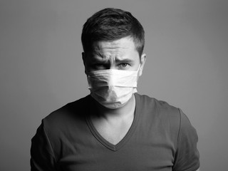 Young Man in Mask. medical masked boy Black and white portrait