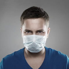 Man in Mask. Epidemic of Coronavirus concept