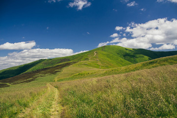 Beautiful Carpathians, mountains in clouds, waterfall, close-up, the sunsets beautifully over the mountains