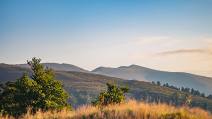 Beautiful Carpathians, mountains in clouds, waterfall, close-up, the sunsets beautifully over the mountains