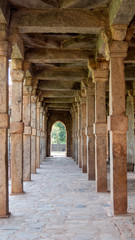 shot of columns at qutub minar complex ruins in delhi