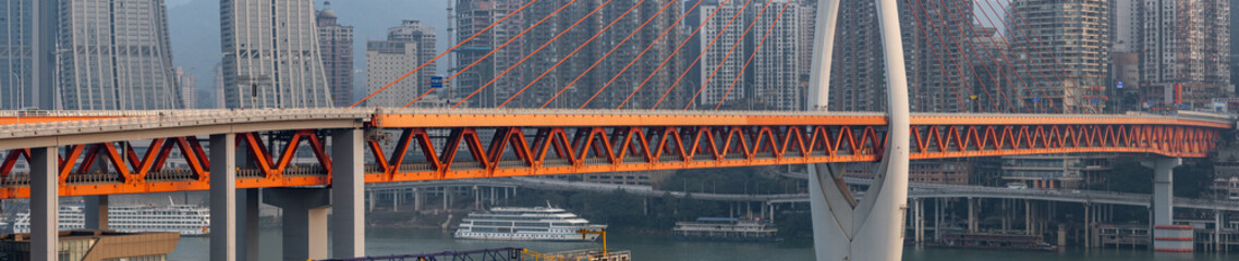 Chongqing, China - Dec 22, 2019: Pano view of Qian si men suspension bridge deck over Jialing river