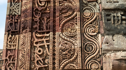 arabic carving at qutub minar complex ruins in delhi