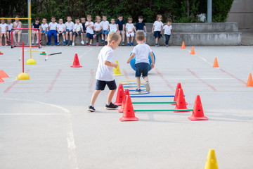 Group of children working on polygon.  Sport school