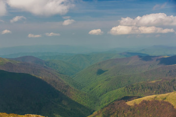 Beautiful Carpathians, mountains in clouds, waterfall, close-up, the sunsets beautifully over the mountains