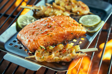 Seafood cooking in a griddle over a BBQ fire
