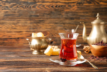 Glass of tasty Turkish tea on table
