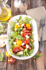 tomato salad with mozzarella and lettuce