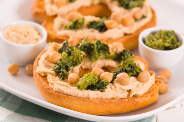 Friselle with turnip tops and hummus.
