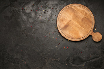 Wooden board on dark background