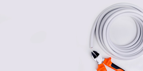 Electrical equipment on grey background with copy space. Top view.