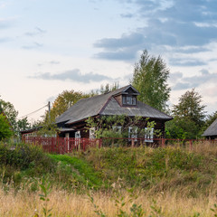 A typical ancient Russian log hut in a small village