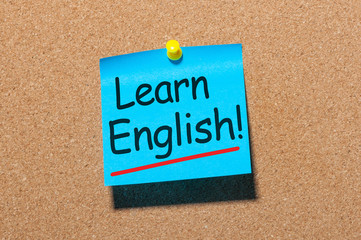 Learn english - note at corkboard background. New opportunities with new skill