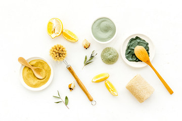Clay mask in bowl for facial spa on white background top view