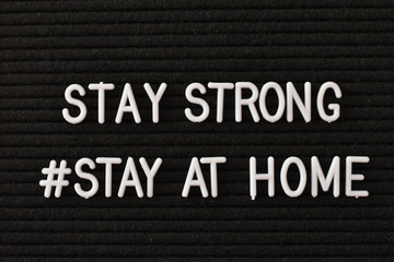 'Stay strong! Stay at home' words on a letterbox