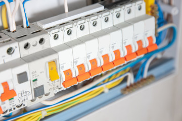Close up elements of consumer electric control panel switchboard for home enclosure for distribution and power electricity