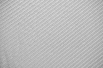 grey striped fabric. lines are parallel