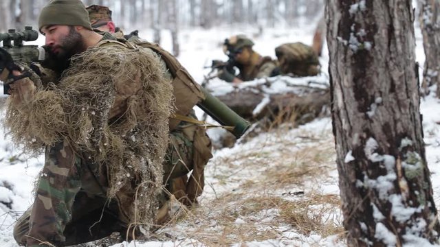 The battlefield. A soldier was wounded, the other tries to help and pulls him