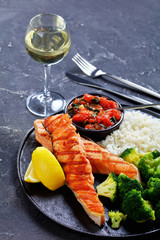 Restaurant serving: salmon steak with white wine