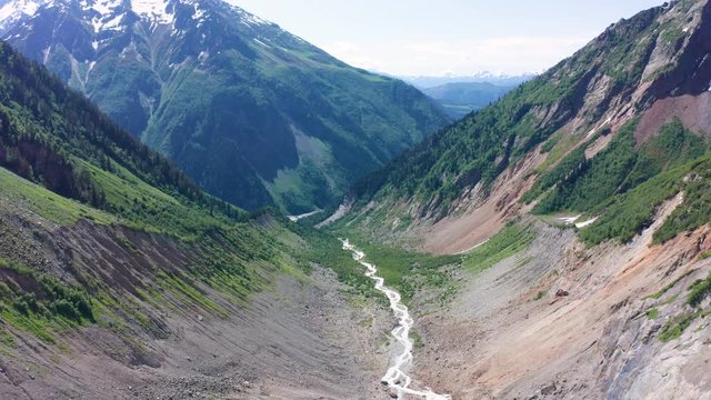 Caucasus Mountains on the border of Russia and Georgia. Chalaat Pass and Very beautiful view of the Chalaadi Glacier, Mount Ushba and Mestiachala river with background of clear blue sky.