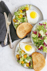 Breakfast with egg, fresh vegetables and croutons. Healthy food concept. Flat lay, top view