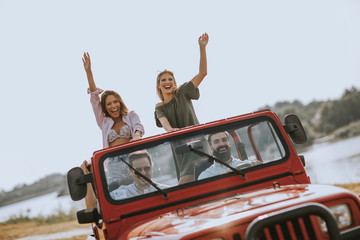 Group of young people enjoying road trip