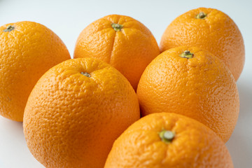 fresh oranges on a white background close up